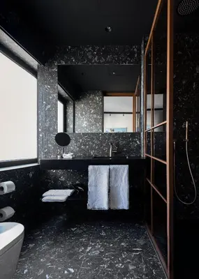 a bathroom with a sink and a toilet and a mirror at Boutique Hotel OLOM - Only Adults recommended in Cádiz
