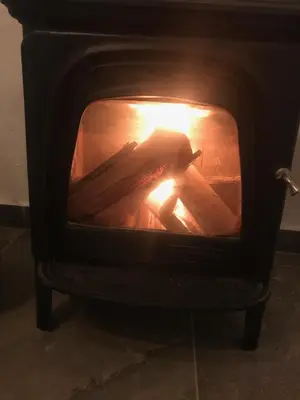 a stove with a fire inside of it at El Lagar de los Abuelos in Arcos de la Frontera