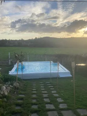a swimming pool in the middle of a yard at El Lagar de los Abuelos in Arcos de la Frontera