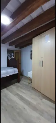 a large room with a bed and a closet at Cathedral two bedroom unit & two balconies in Cádiz