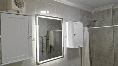 a bathroom with a shower and a glass window at A 50 metros de la playa in Cádiz