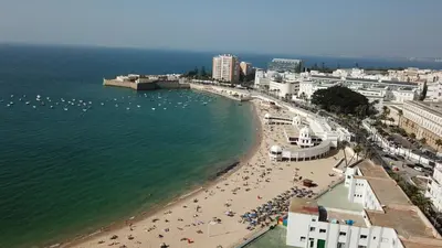 an aerial view of a beach with a crowd of people at El Balneario in Cádiz