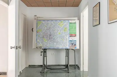 a projection screen on a wall in a room at Sherryflat Casa del Arquitecto in Jerez de la Frontera