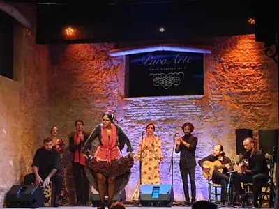 a group of people standing on a stage at Sherryflat Casa del Arquitecto in Jerez de la Frontera