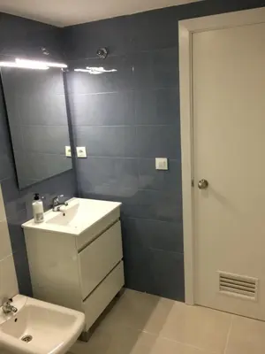 a bathroom with a sink and a mirror at Luminoso apartamento en playa las redes, entorno natural pinares y dunas. Wifi in El Puerto de Santa María