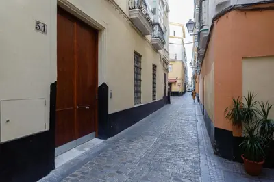 an empty alley with a person walking down the street at SAIL Family Home by Cadiz4Rentals in Cádiz