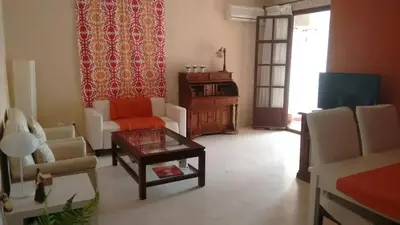 a living room with a couch and a coffee table at Charming apartment in El Puerto de Santa María with terrace in El Puerto de Santa María