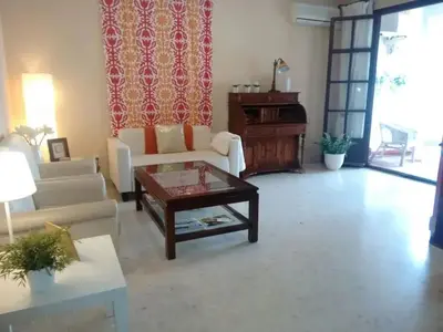 a living room with a couch and a coffee table at Charming apartment in El Puerto de Santa María with terrace in El Puerto de Santa María