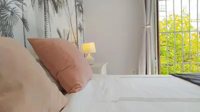 a bedroom with a bed with a pillow and a window at Sherryflat San Agustín in Jerez de la Frontera
