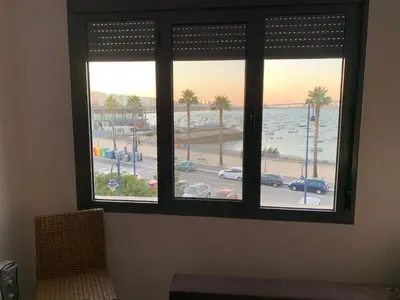 a window with a view of a parking lot at Apartamento Aqua Vitae in Cádiz