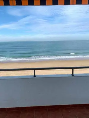 a view of the beach from a balcony at El Mirador de la Playa Cortadura Grupo AC Gestion in Cádiz
