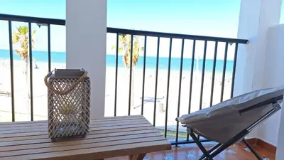 a balcony with a bench and a view of the beach at TU DENSCANSO EN VALDELAGRANA FRENTE AL MAR in El Puerto de Santa María