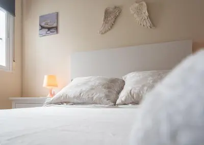 two pillows on a bed in a bedroom at Apartment Cadiz´s Angel in Cádiz