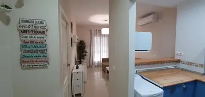 a bathroom with a sink and a toilet in a room at Los luceros in Rota