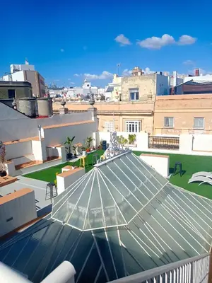 a glass roof on top of a building at Planeta Cadiz Hostel in Cádiz