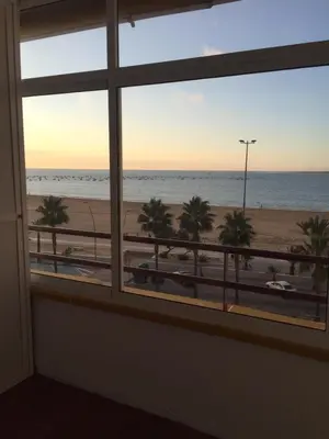 a view of the beach from a window at PISO 1ª LINEA SANLUCAR DE BARRAMEDA in Sanlúcar de Barrameda