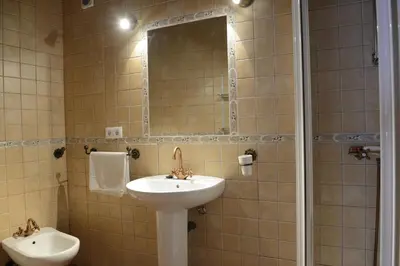 a bathroom with a sink and a mirror at Casa Rural Las Cadenas del Cananeo in Arcos de la Frontera