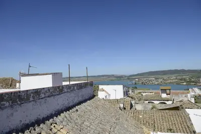 a view from the roof of a town with a river at Casa Rural Las Cadenas del Cananeo in Arcos de la Frontera