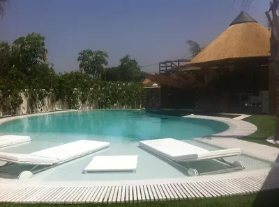 a swimming pool with lounge chairs and a gazebo at Villa Campito in El Puerto de Santa María
