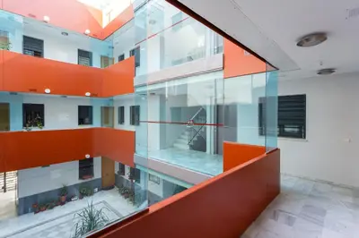 an external view of a building with orange accents at Puerta San FELIX free parking by Cadiz4Rentals in Cádiz