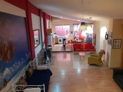 a living room with a couch and a living room at Loft céntrico y confortable in Jerez de la Frontera