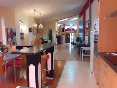 a kitchen with a large island in a room at Loft céntrico y confortable in Jerez de la Frontera