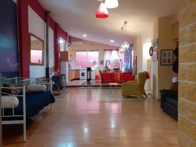 a living room with a couch and a table at Loft céntrico y confortable in Jerez de la Frontera