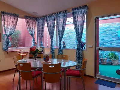 a dining room with a table and chairs and a window at Loft céntrico y confortable in Jerez de la Frontera