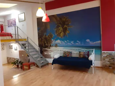a living room with a mural of the ocean at Loft céntrico y confortable in Jerez de la Frontera
