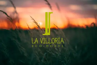 a logo for a hotel with a field of grass at Hotel La Villoría in Medina Sidonia