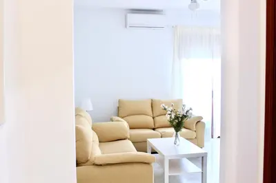 a living room with a couch and a table at City CENTER and Free PARKING apartment in Jerez de la Frontera