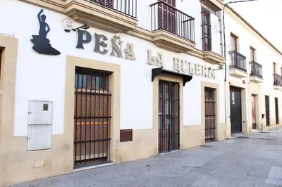 a building with a sign on the side of a street at City CENTER and Free PARKING apartment in Jerez de la Frontera