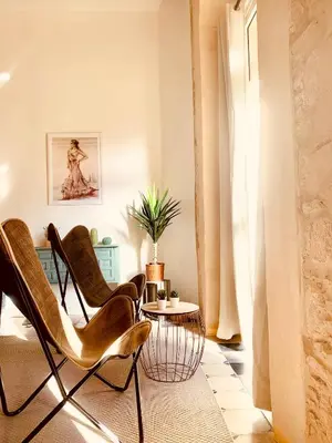 a living room with chairs and a table at Feel the Sherry experience1 by Musgo in Jerez de la Frontera
