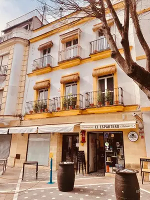 a building with windows and balconies on a street at Feel the Sherry experience1 by Musgo in Jerez de la Frontera