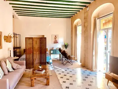 a living room with a couch and a table at Feel the Sherry experience1 by Musgo in Jerez de la Frontera
