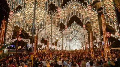 a crowd of people standing in front of a carnival at Apartamento Centro Sol Plazuela in Jerez de la Frontera