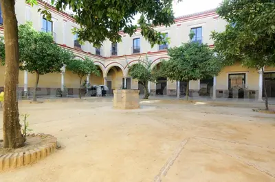 a large courtyard in front of a building at Loft24Sanlúcar in Sanlúcar de Barrameda