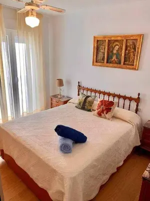 a bedroom with a bed with a blue stuffed animal on it at Puerta de Santa Maria Grupo AC Gestion in Cádiz