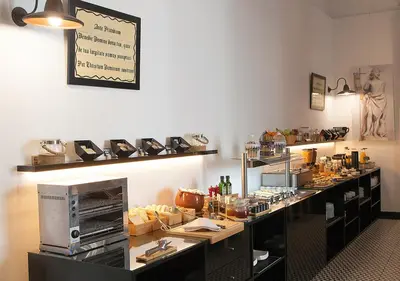 a kitchen with a counter with food on it at Hotel Boutique Convento Cádiz in Cádiz