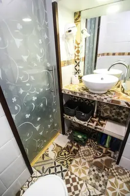 a bathroom with a sink and a mirror at SH L'Azotea D'Horozco. Ático con terraza. AC, WiFi in Cádiz