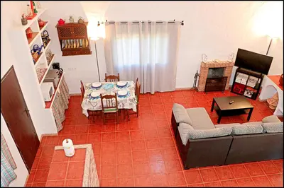 a living room with a couch and a table at Casa Roche Viejo in Conil de la Frontera