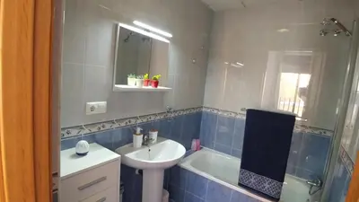 a bathroom with a sink and a toilet and a tub at Apartamento Jerez Terraza Privada in Jerez de la Frontera