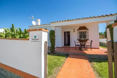 a villa with a view of the backyard at Chalet Pedro III in Conil de la Frontera