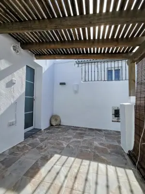 a large room with white walls and a wooden ceiling at TRIPERIA 25 in Medina Sidonia