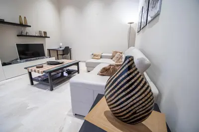 a living room with a couch and a table at Apartamento Relax in Cadiz in Cádiz