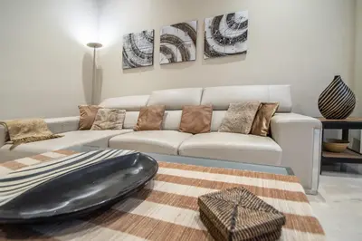 a living room with a couch and a table at Apartamento Relax in Cadiz in Cádiz