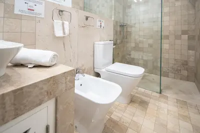 a bathroom with a toilet and a sink and a shower at Apartamento Relax in Cadiz in Cádiz