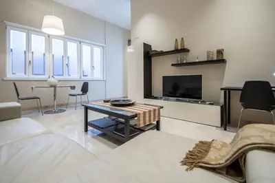 a living room with a couch and a tv at Apartamento Relax in Cadiz in Cádiz