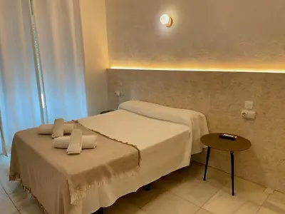 a bathroom with a tub and a sink and a toilet at BOHEMIA SANLUCAR in Sanlúcar de Barrameda