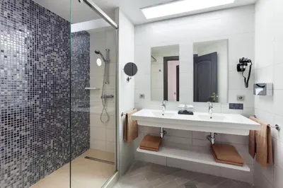 a bathroom with a sink and a shower at Hotel Riu Chiclana - All Inclusive in Chiclana de la Frontera